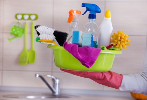 Team cleaning a kitchen thoroughly in a home