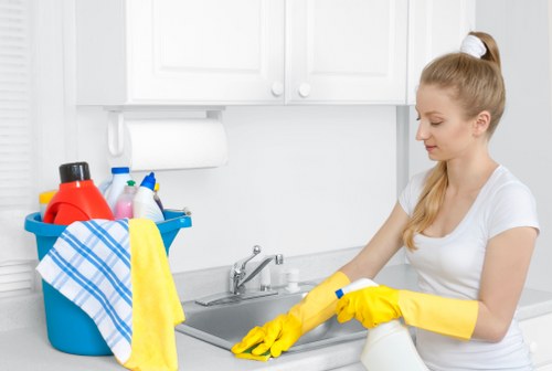 Team of house cleaners preparing equipment